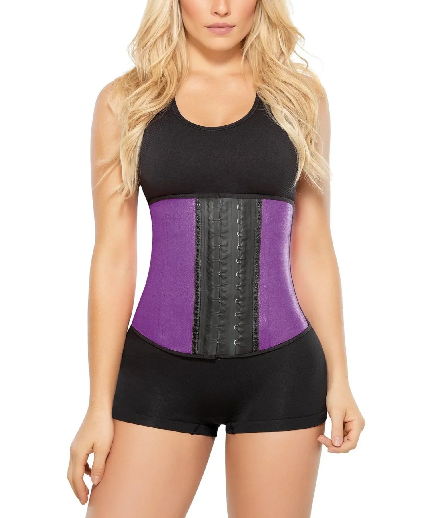 Woman wearing Ann Chery purple latex waist trainer and black workout outfit, shapewear brand