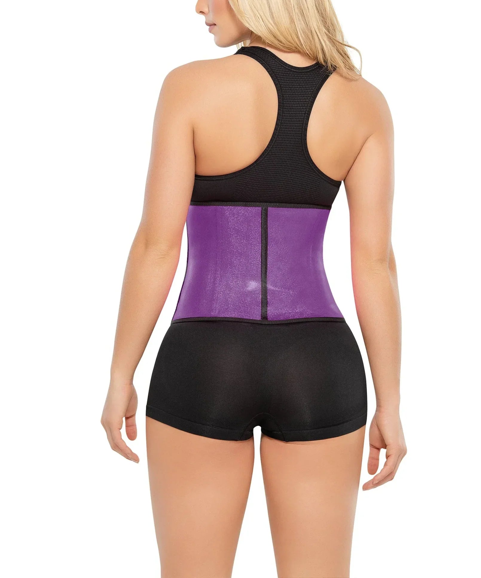 Woman wearing a purple Ann Chery latex waist trainer, black activewear top and shorts, back view