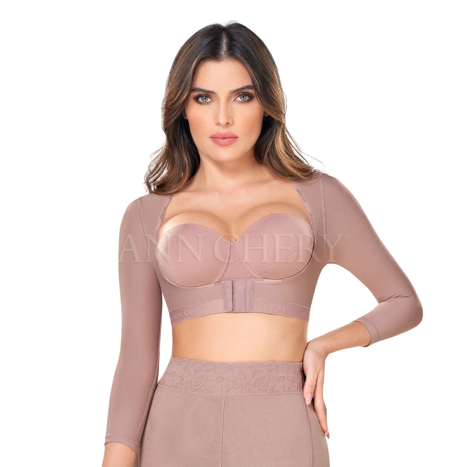 Woman wearing nude long sleeve compression arm shaper with high-waisted shapewear