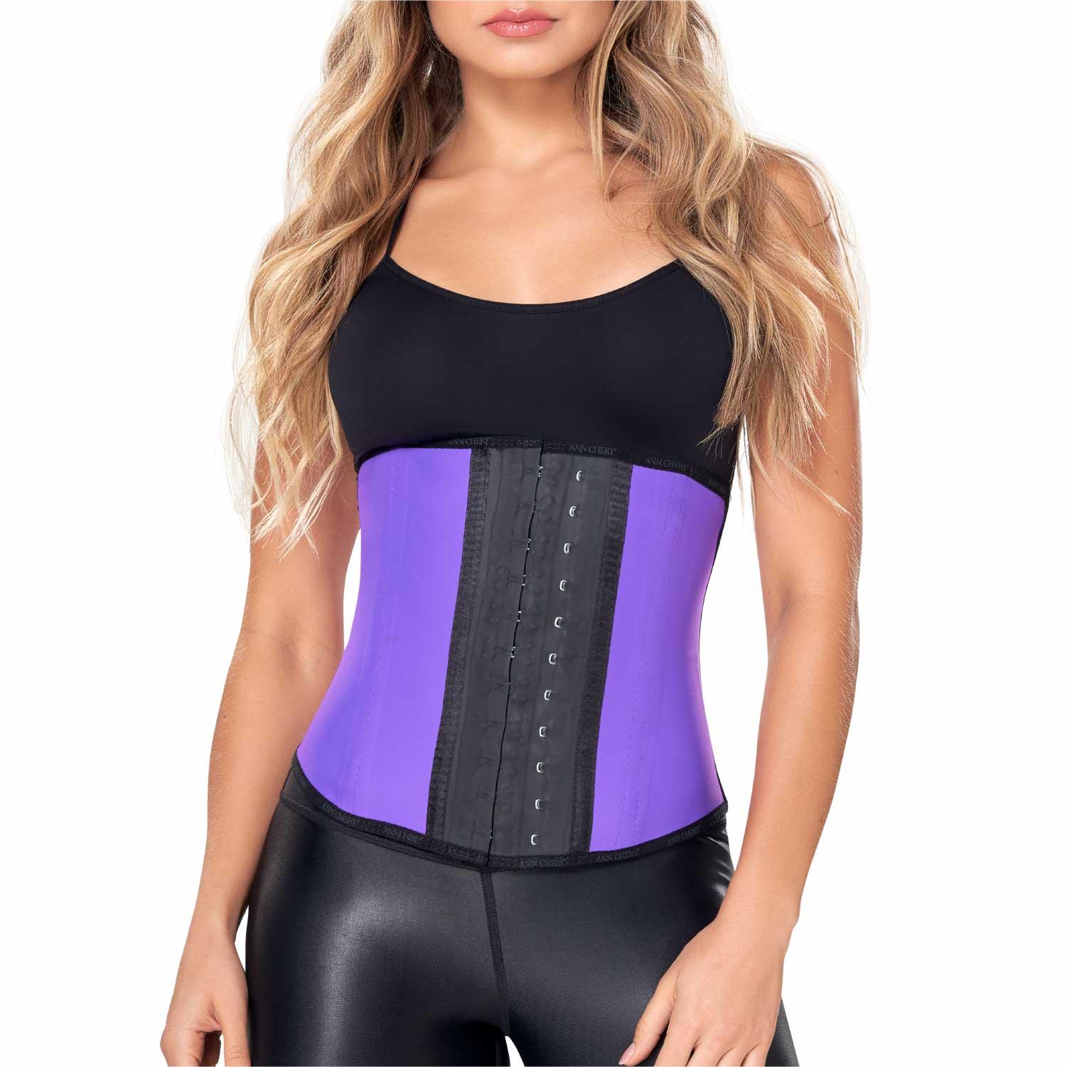 Woman wearing Ann Chery purple latex waist trainer, black tank top, and leggings
