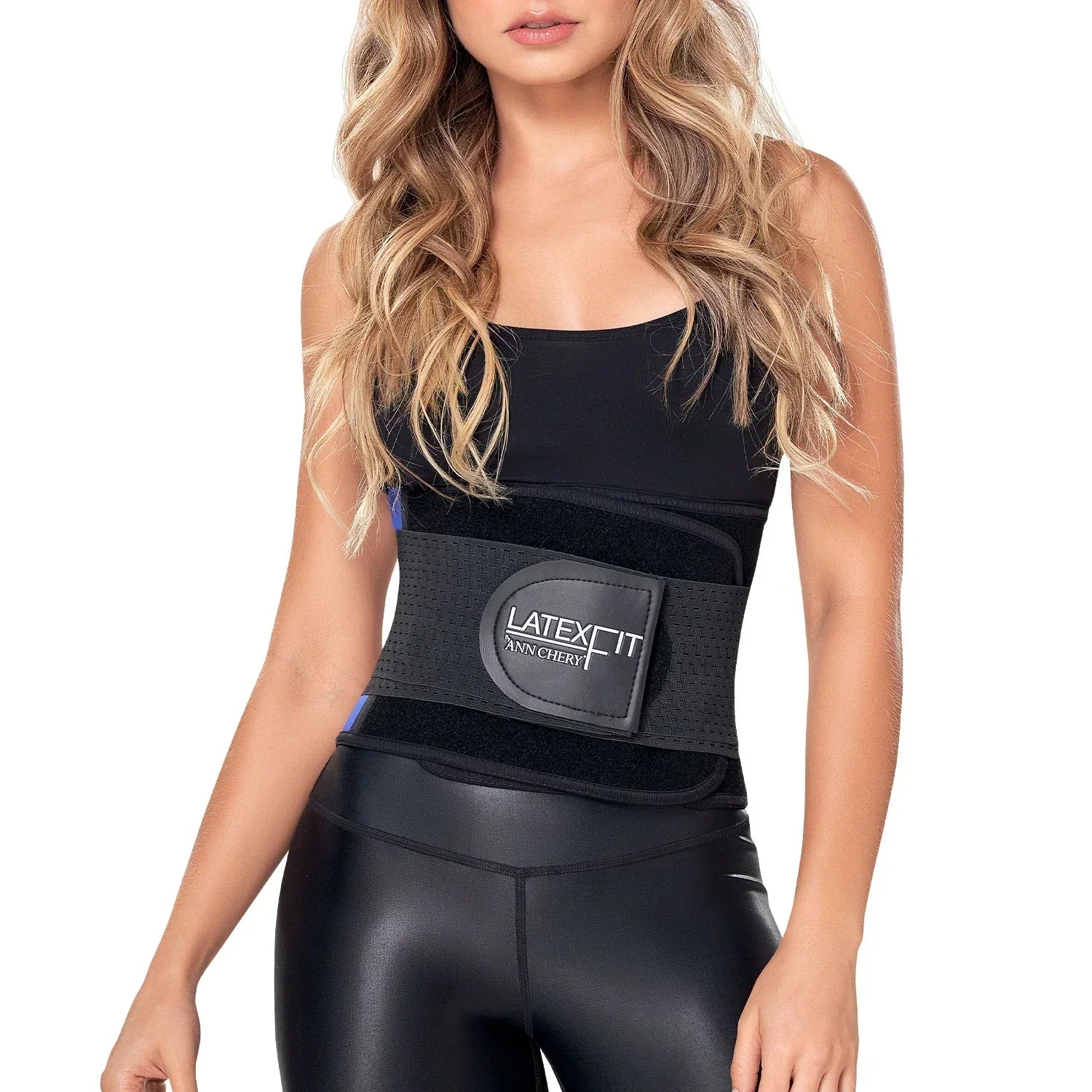 Woman wearing black latex waist trainer belt and black athletic outfit, front view