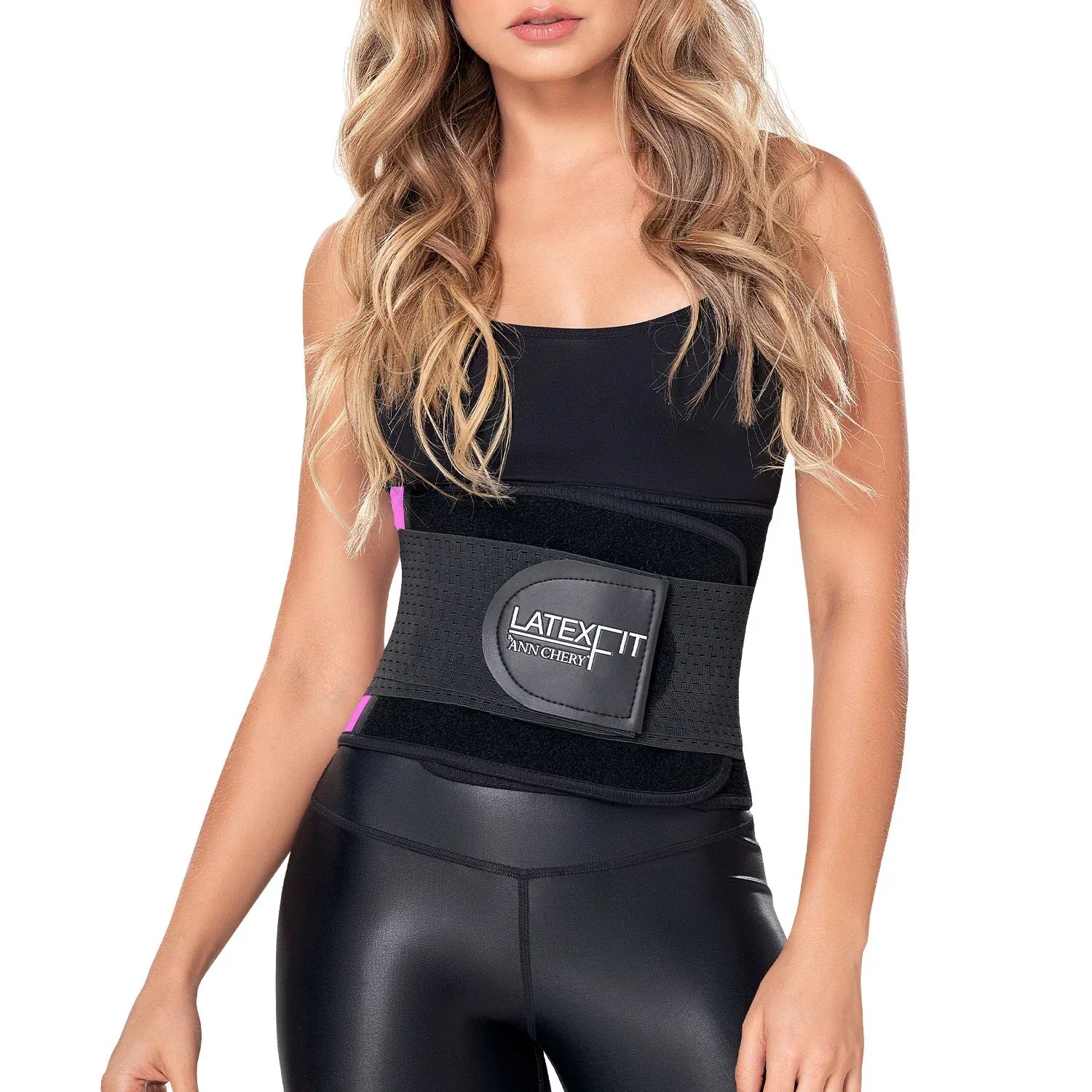 Woman wearing black latex waist trainer belt over tank top and leggings for tummy control